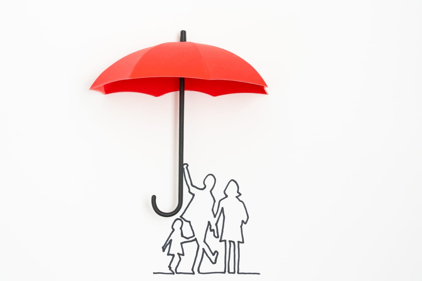Red umbrella sheltering a family, an insurance image