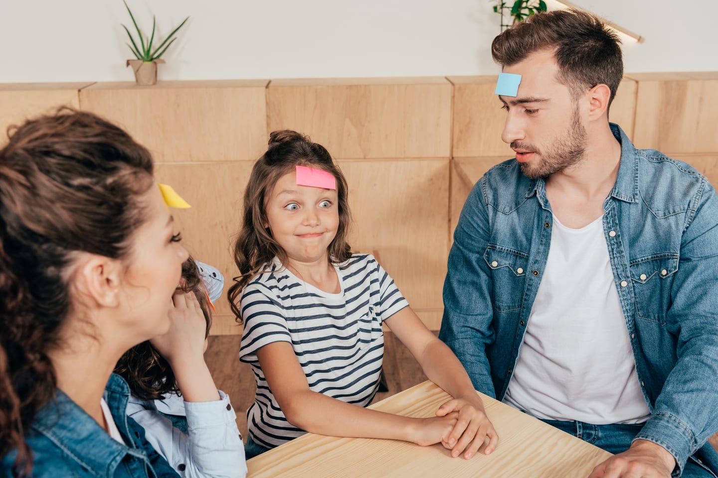 Family with young children playing together at home