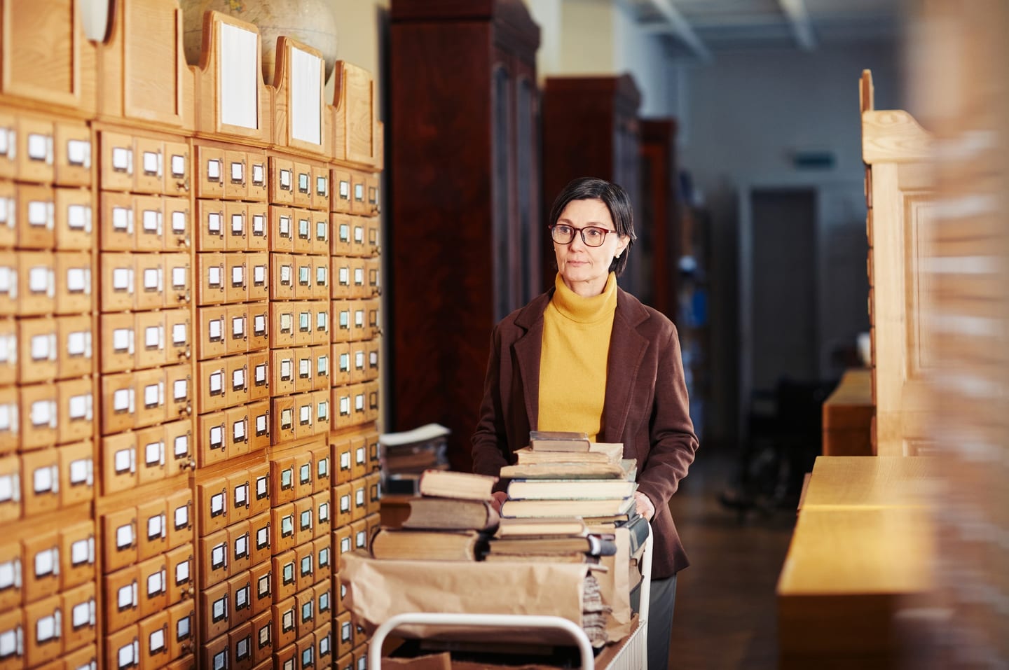Woman studying at a library desk