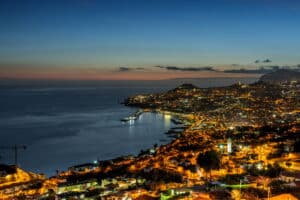Aerial cityscape of Illuminated Funchal, Madeira at twilight