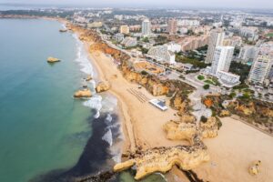 Aerial drone view of Portimao skyline and city beach of Praia da Rocha , Algarve,Portugal