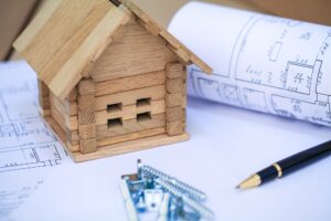 Building house on blueprints with plan - construction project