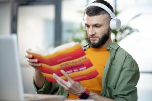 Close up of man having audio lesson in Portuguese language